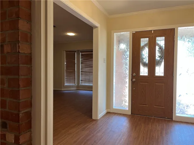 a view of hallway with a wooden floor