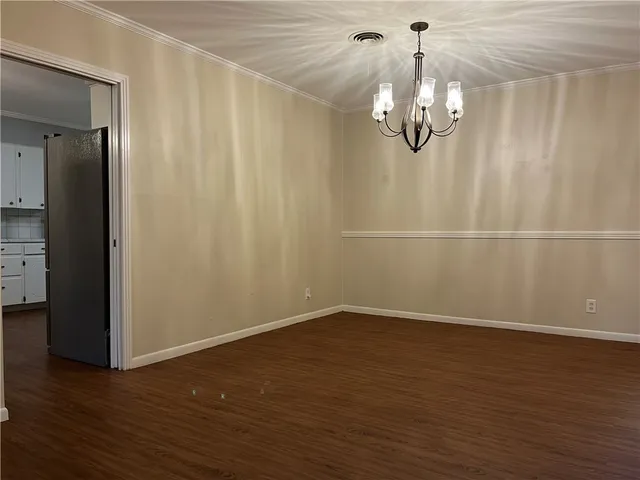 an empty room with wooden floor