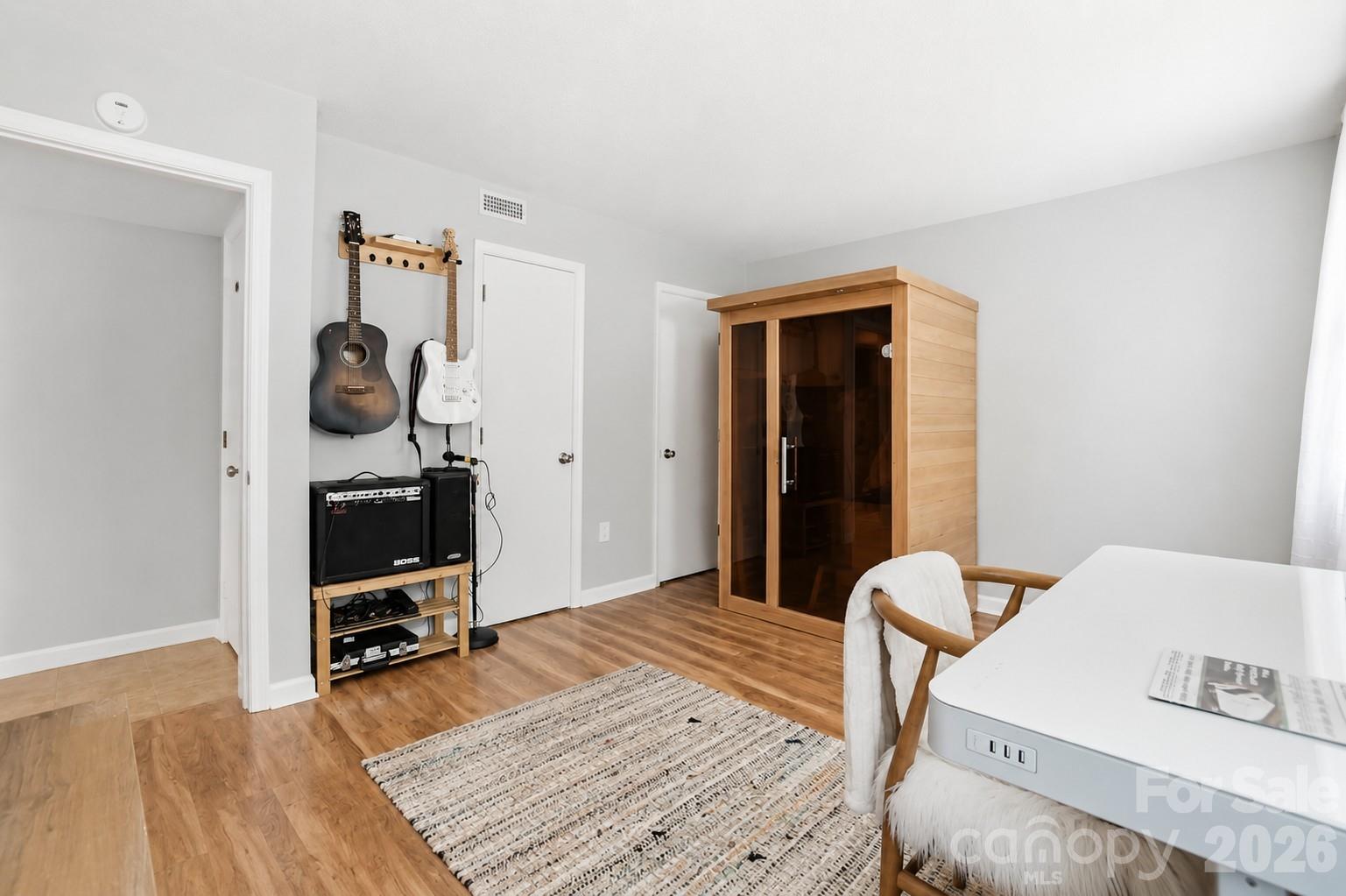 824 Riverwood Road Charlotte, NC 28270 - Photo 23 of 37 a bedroom with a bed and a wooden floor