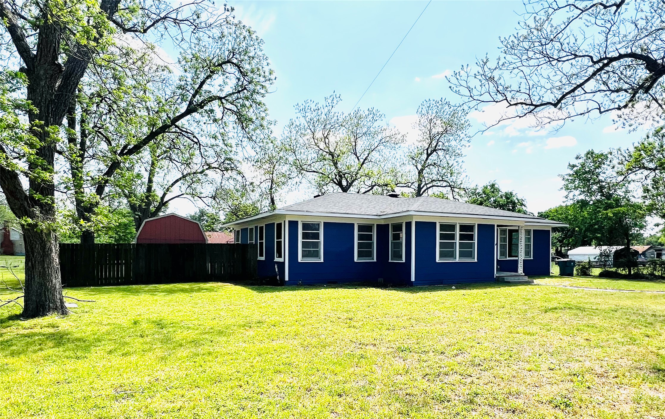1307 West Main Street Cameron, TX 76520 - Photo 1 of 1 View of side of property with fence and a yard