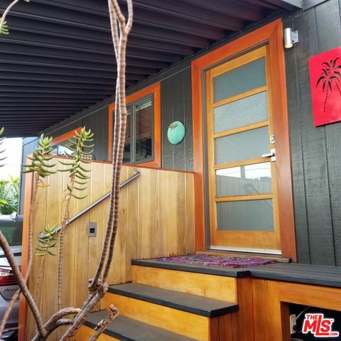 a view of balcony with wooden floor and door