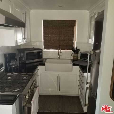 a kitchen with a stove and a refrigerator