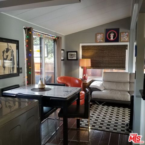 a view of a dining room with furniture and window