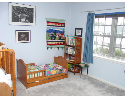 141 Lake Shore Road, Unit 3 Boston, MA 02135 - Photo 11 of 20 a bedroom with furniture and a window