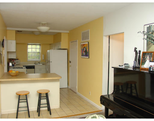141 Lake Shore Road, Unit 3 Boston, MA 02135 - Photo 5 of 20 a kitchen with a table and chairs