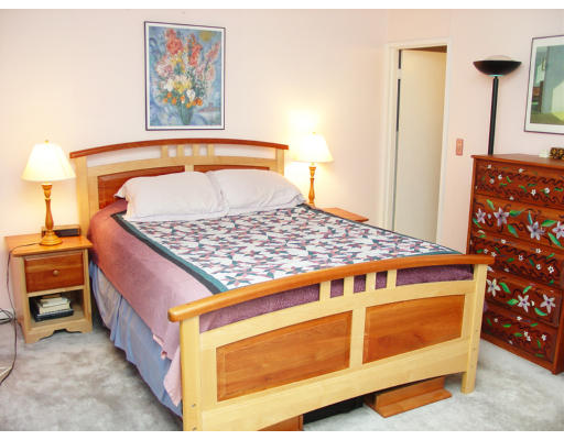 141 Lake Shore Road, Unit 3 Boston, MA 02135 - Photo 9 of 20 a bedroom with a bed and dresser