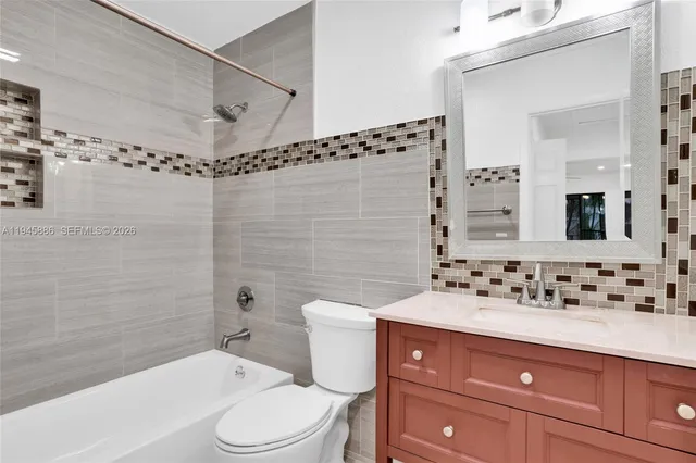 a view of a hallway with wooden floor and a floor to ceiling window