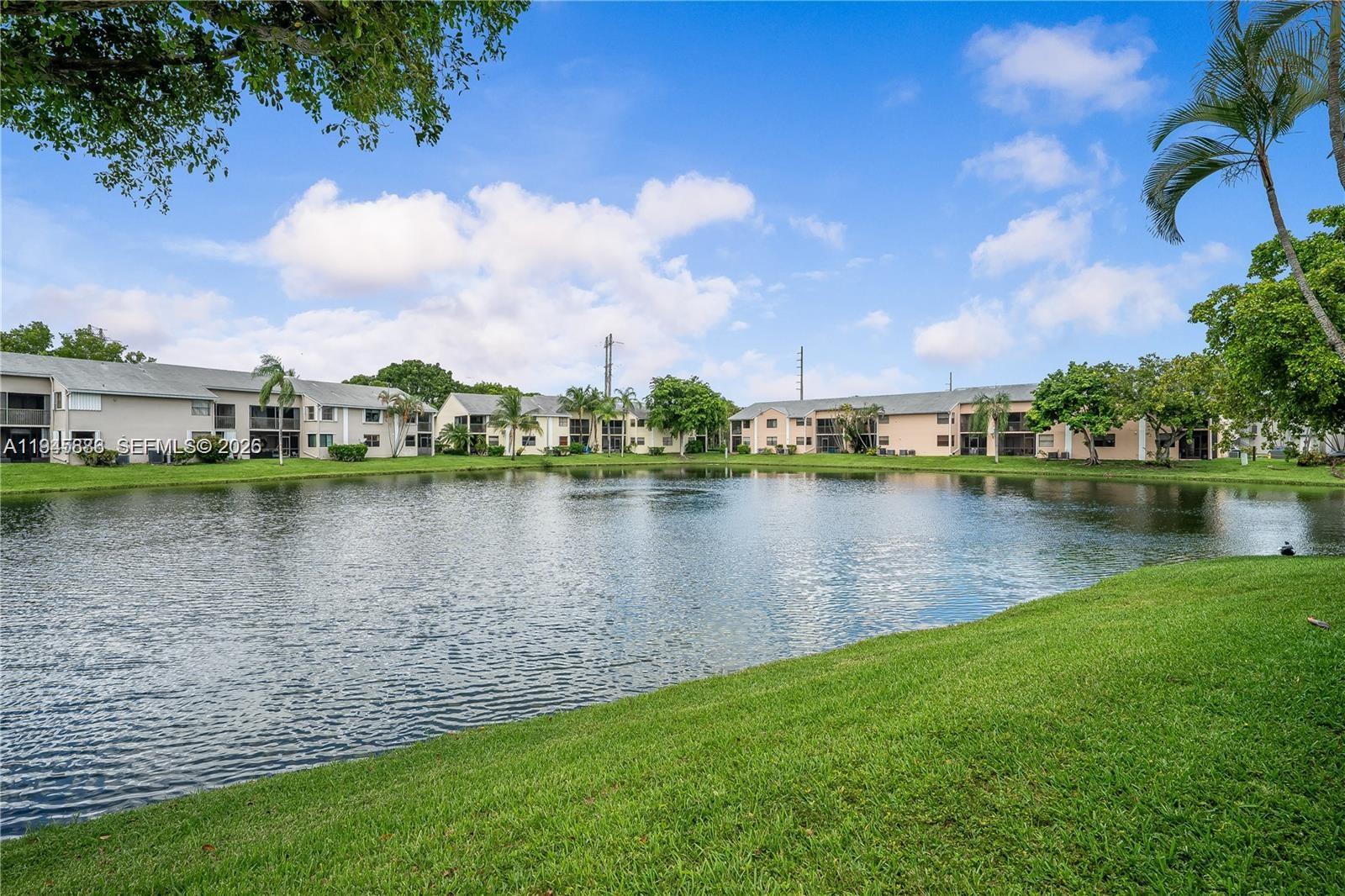 1031 Adams Avenue, Unit 1031I Homestead, FL 33034 - Photo 25 of 33 a view of a lake with houses in the back