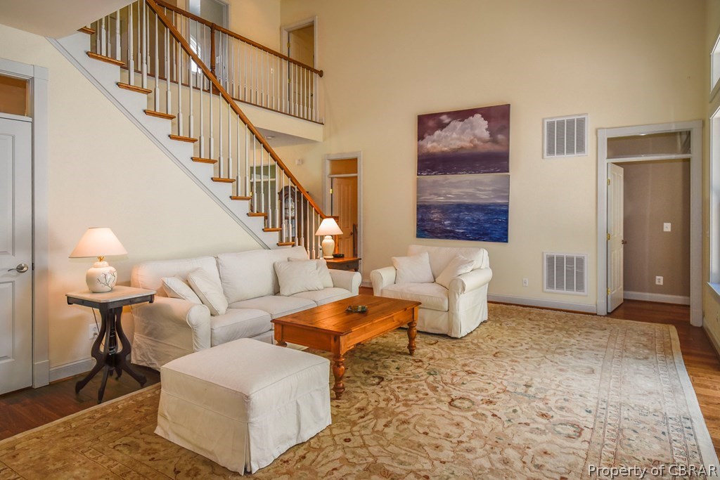 137 Mastons Wharf Road Lancaster, VA 22503 - Photo 5 of 39 a living room with furniture and a rug