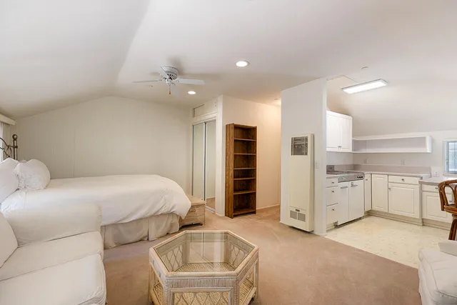 a kitchen with stainless steel appliances a stove a sink and a refrigerator