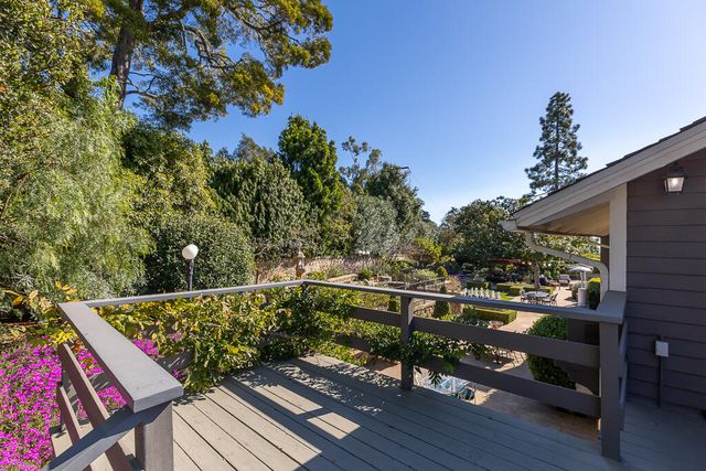 a view of a chairs and table in the patio