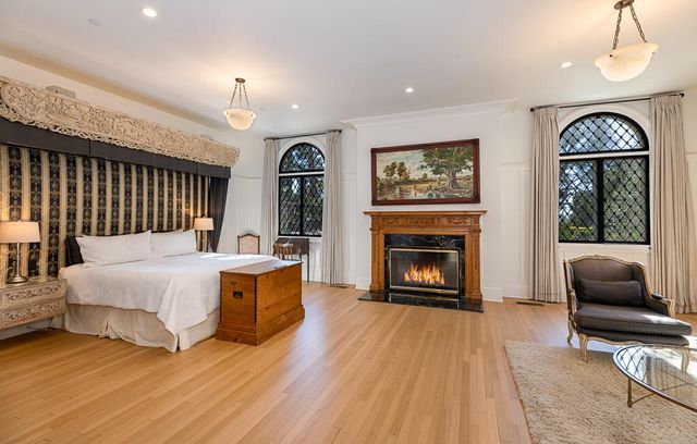 a bed room with furniture and a fireplace