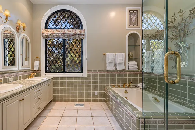 a bathroom with a sink a mirror and a bathtub