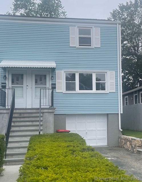 7 Eclipse Avenue, Unit B Norwalk, CT 06851 - Photo 1 of 14 a front view of a house with a yard