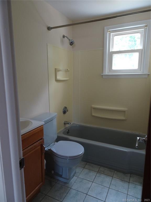 7 Eclipse Avenue, Unit B Norwalk, CT 06851 - Photo 11 of 14 a bathroom with a toilet a sink and shower