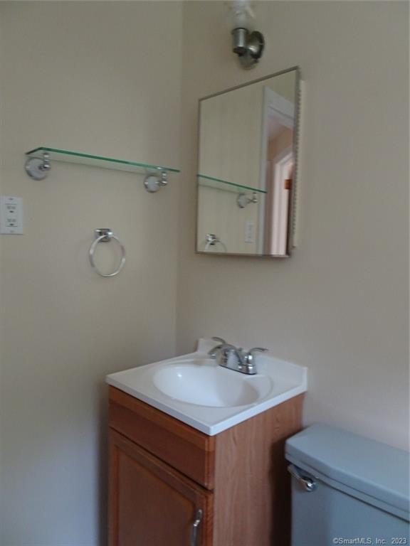 7 Eclipse Avenue, Unit B Norwalk, CT 06851 - Photo 12 of 14 a bathroom with a sink and a mirror