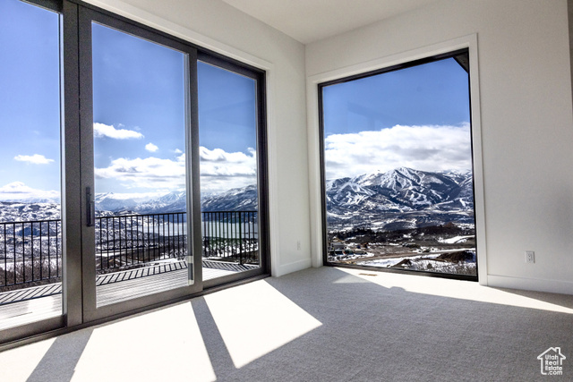 2132 East Outlaw Road, Unit 49 Kamas, UT 84036 - Photo 15 of 44 Empty room featuring carpet flooring and a mountain view