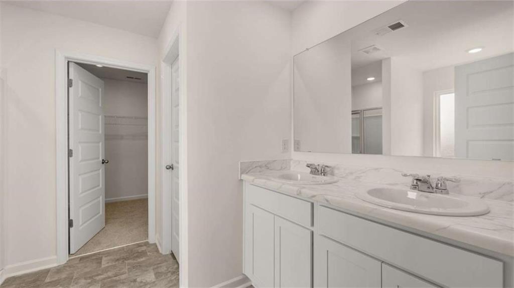 314 Friendship Oak Way Hampton, GA 30228 - Photo 16 of 32 a bathroom with a sink and a mirror