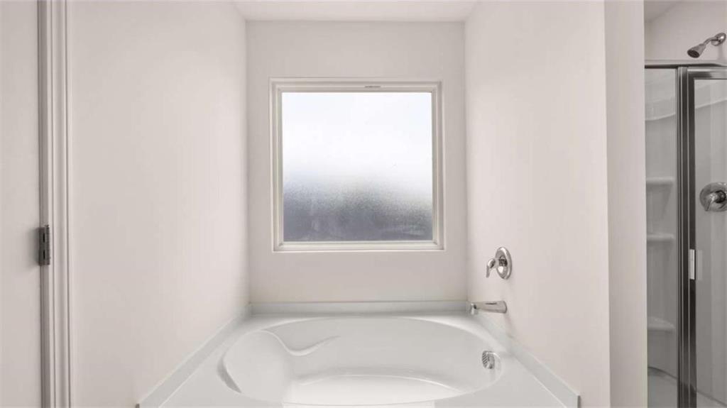 314 Friendship Oak Way Hampton, GA 30228 - Photo 18 of 32 a white bath tub sitting next to a window