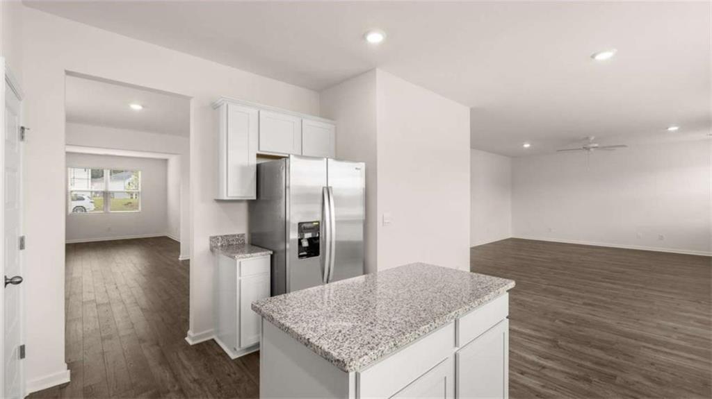314 Friendship Oak Way Hampton, GA 30228 - Photo 6 of 32 a kitchen with stainless steel appliances granite countertop a refrigerator and a sink