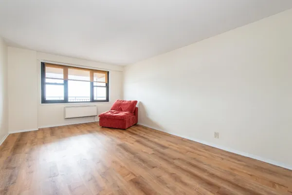 a living room with a couch and a window