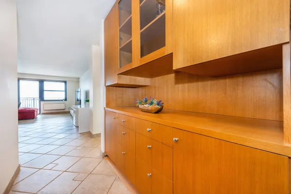a view of washer and dryer with kitchen in the background