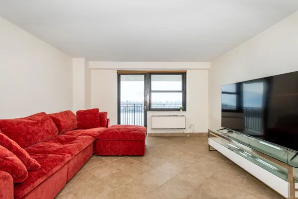 a living room with furniture and a large window