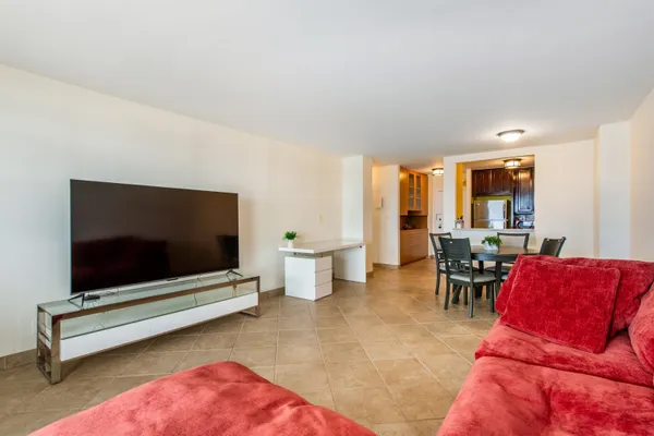 a view of a dining room with furniture and window
