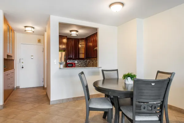 a kitchen with stainless steel appliances granite countertop a refrigerator stove and sink