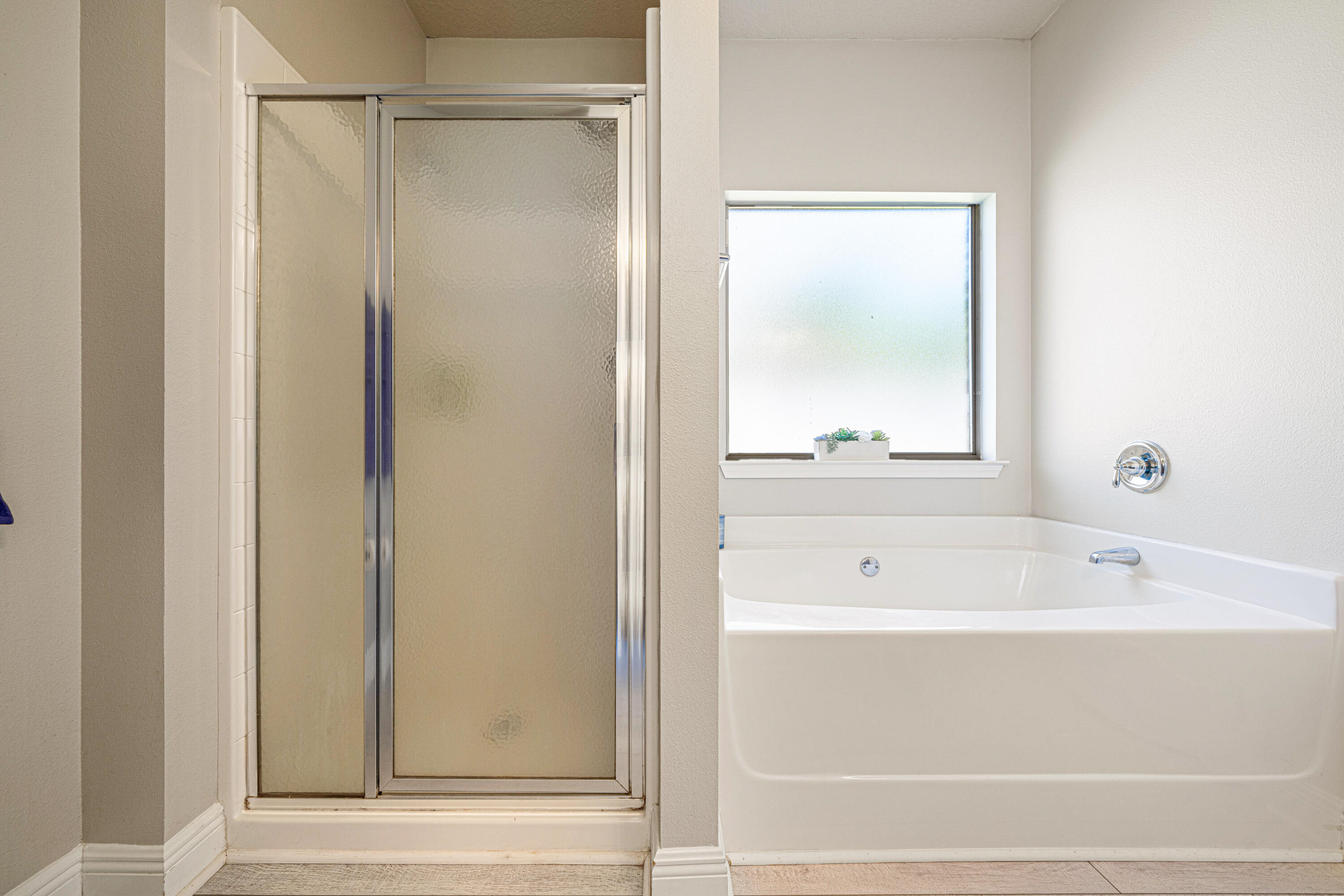 634 Red Fern Road Crestview, FL 32536 - Photo 13 of 21 a bathroom with a bathtub and a shower