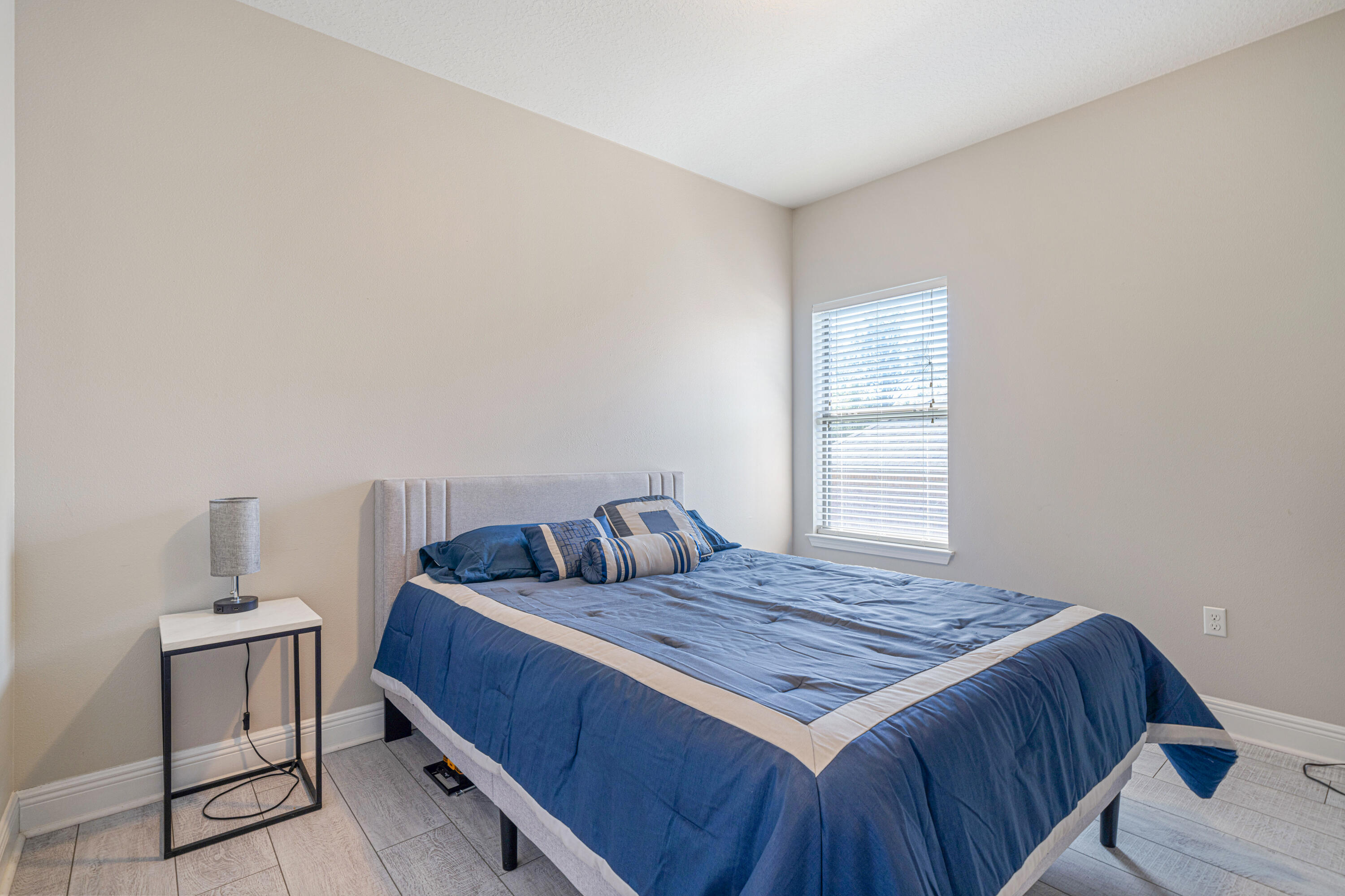 634 Red Fern Road Crestview, FL 32536 - Photo 16 of 21 a bedroom with a bed and chair