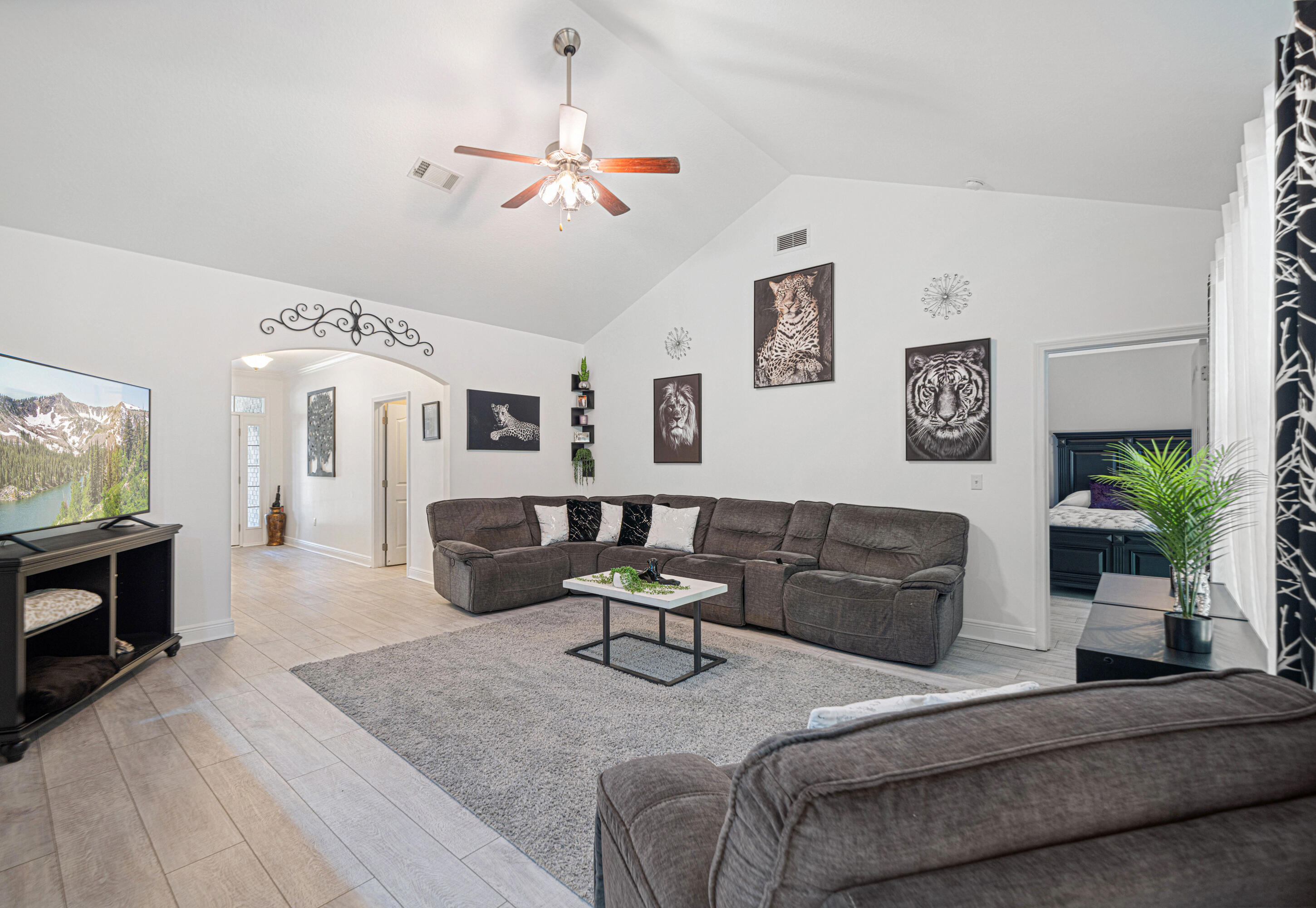 634 Red Fern Road Crestview, FL 32536 - Photo 3 of 21 a living room with furniture and a flat screen tv