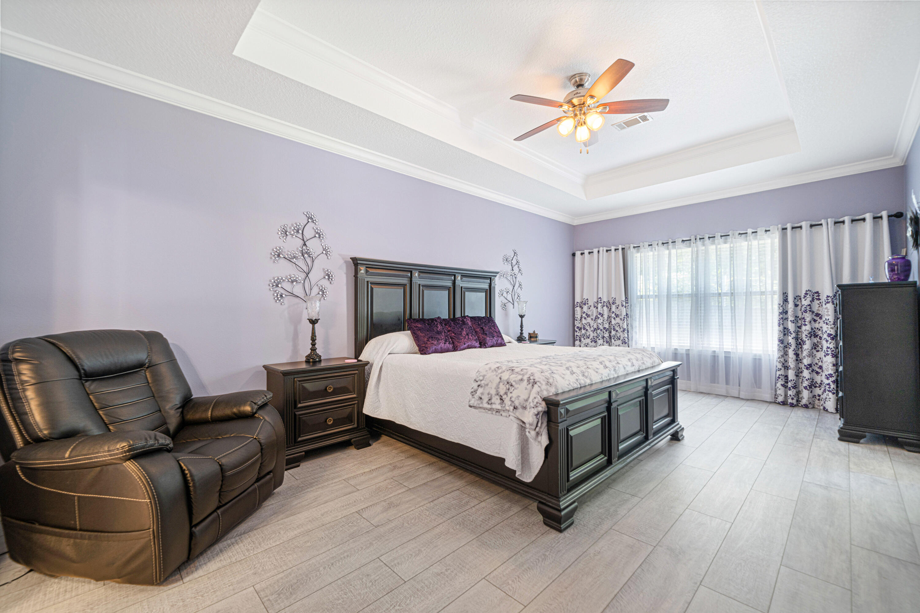 634 Red Fern Road Crestview, FL 32536 - Photo 10 of 21 a bed room with a bed and a couch