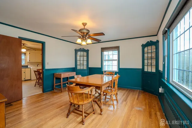 a dining room with furniture and window