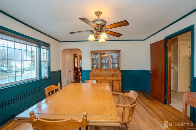 a bedroom with a bed dresser and a window