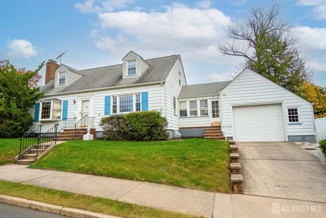 a view of a house with a yard and plants