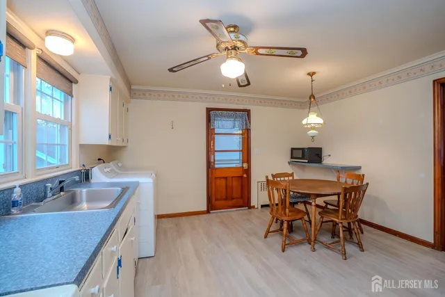 a kitchen with a table and chairs in it