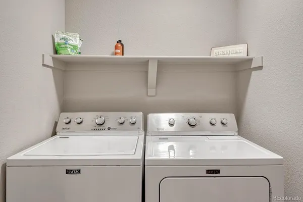 a utility room with dryer and washer