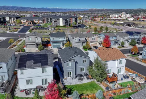 a view of multiple houses with a city street