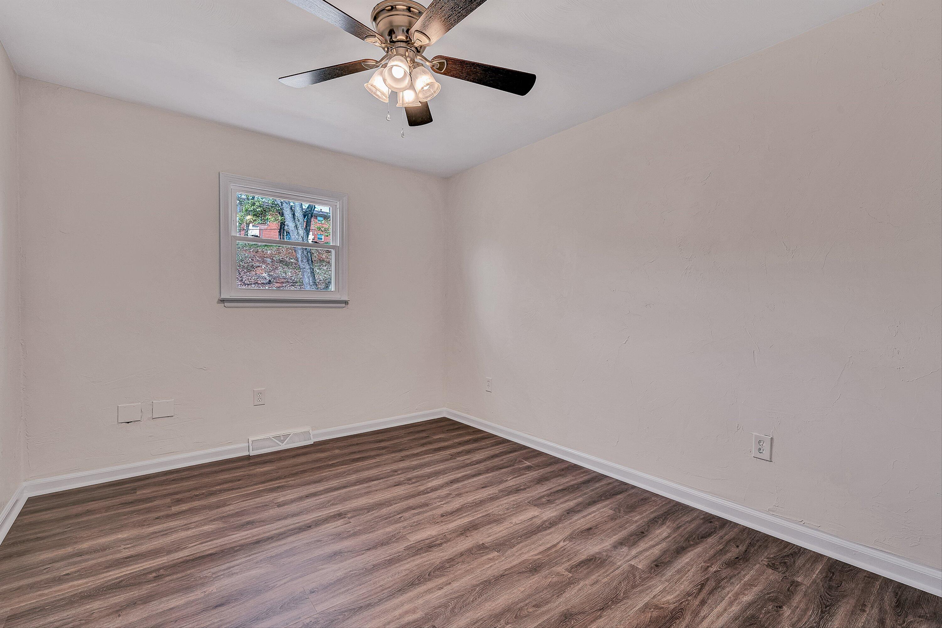 736 Ramada Road Vinton, VA 24179 - Photo 12 of 37 a view of an empty room with wooden floor