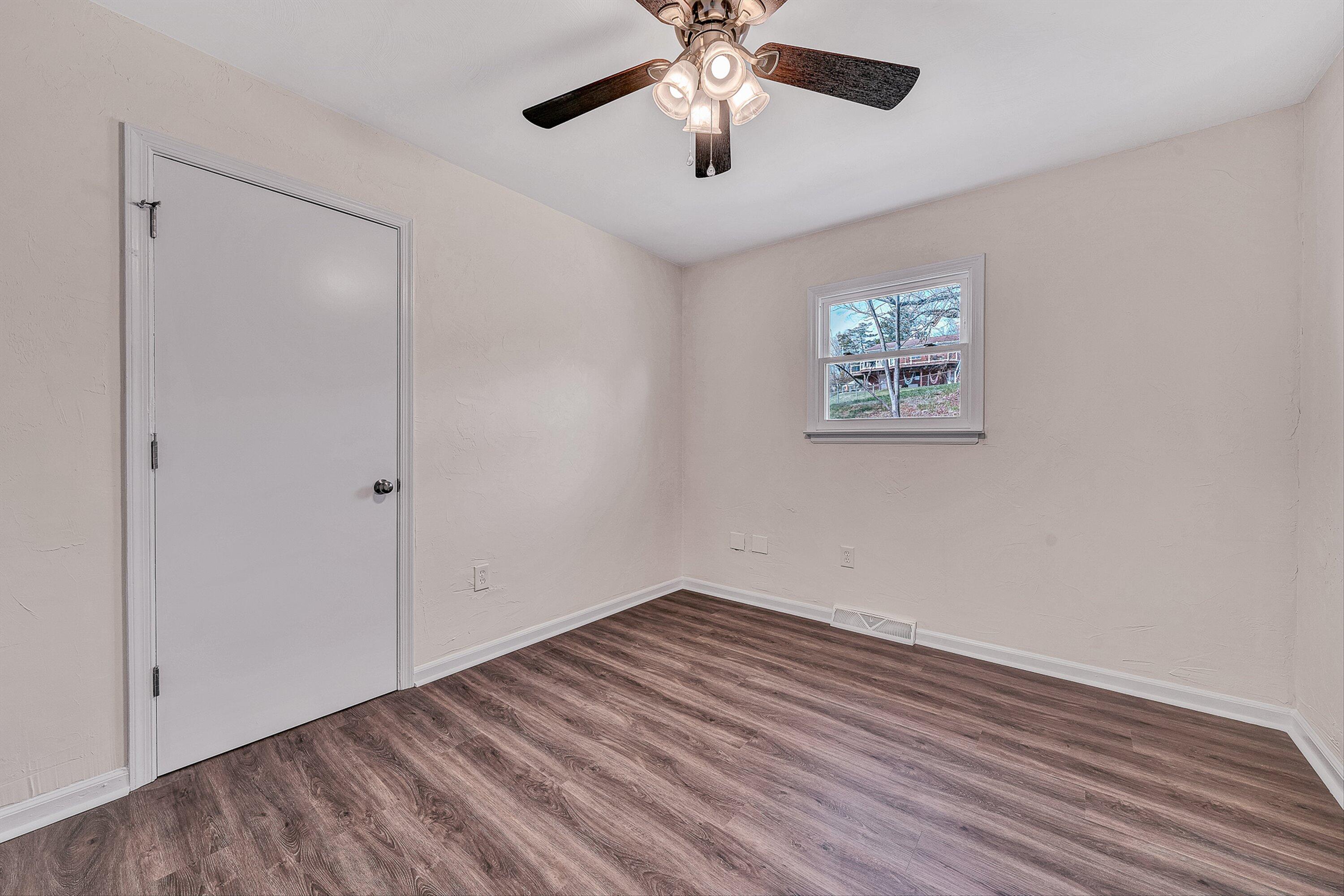 736 Ramada Road Vinton, VA 24179 - Photo 13 of 37 a view of empty room with wooden floor
