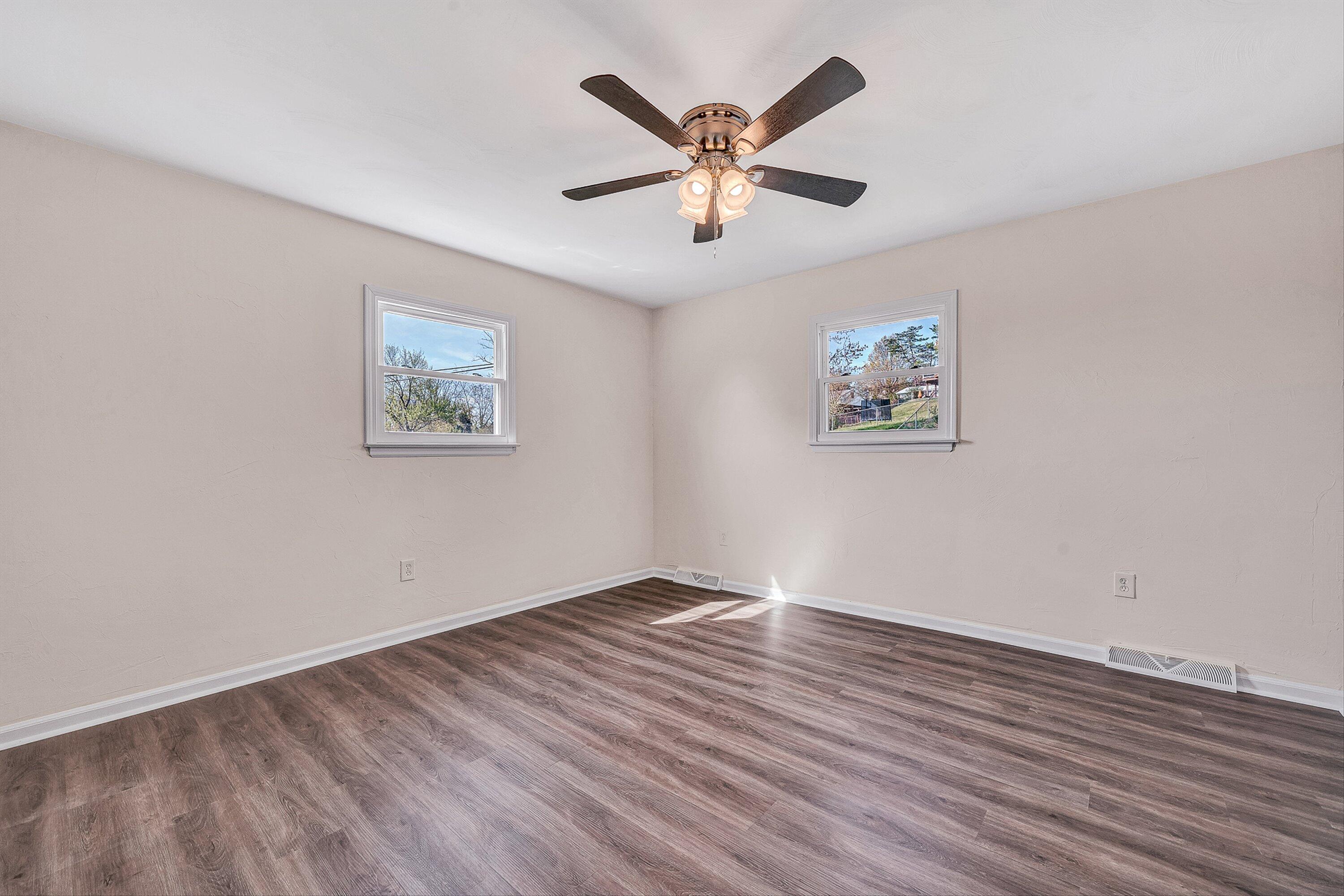 736 Ramada Road Vinton, VA 24179 - Photo 14 of 37 a view of empty room with wooden floor