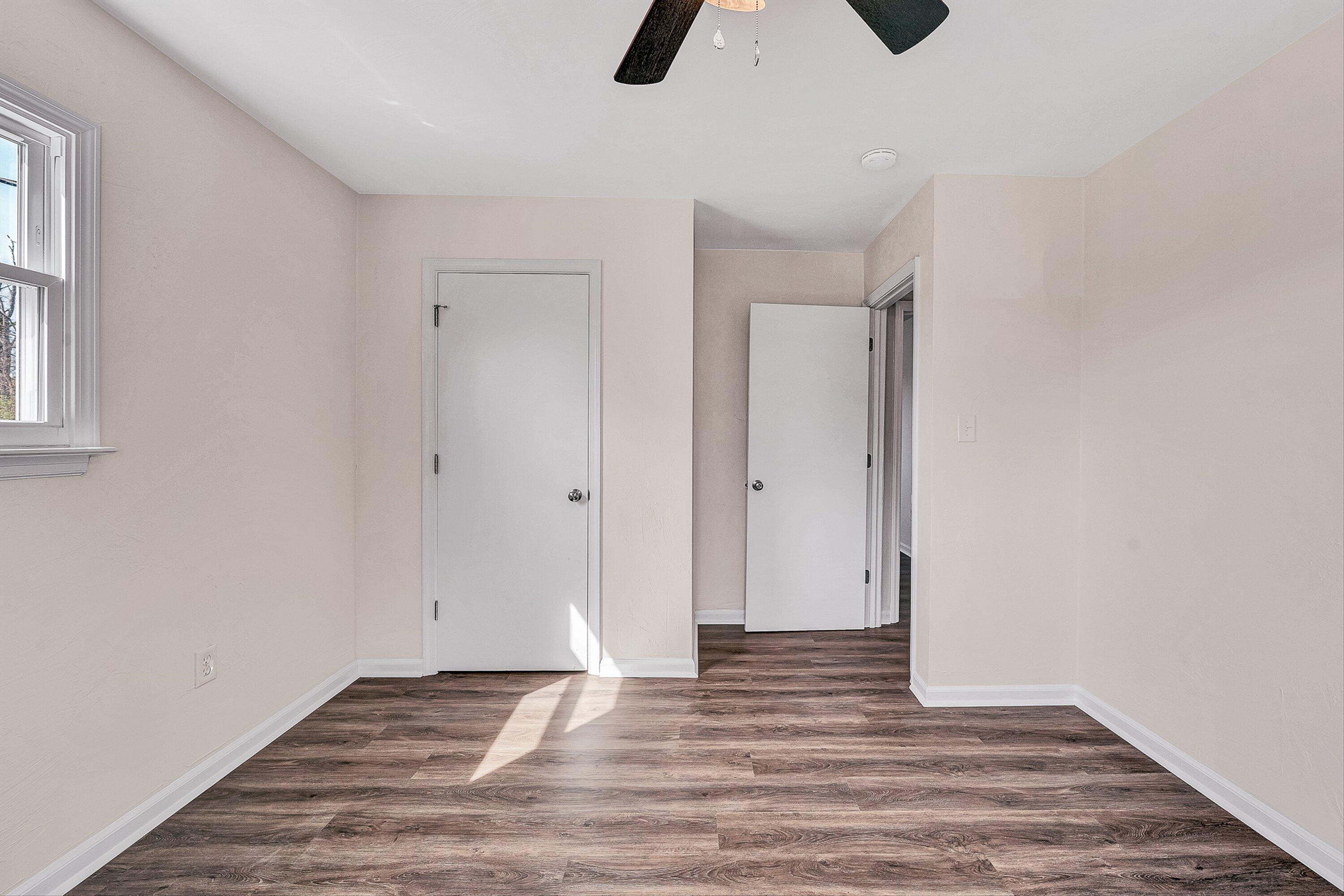 736 Ramada Road Vinton, VA 24179 - Photo 19 of 37 a view of an empty room with window and wooden floor