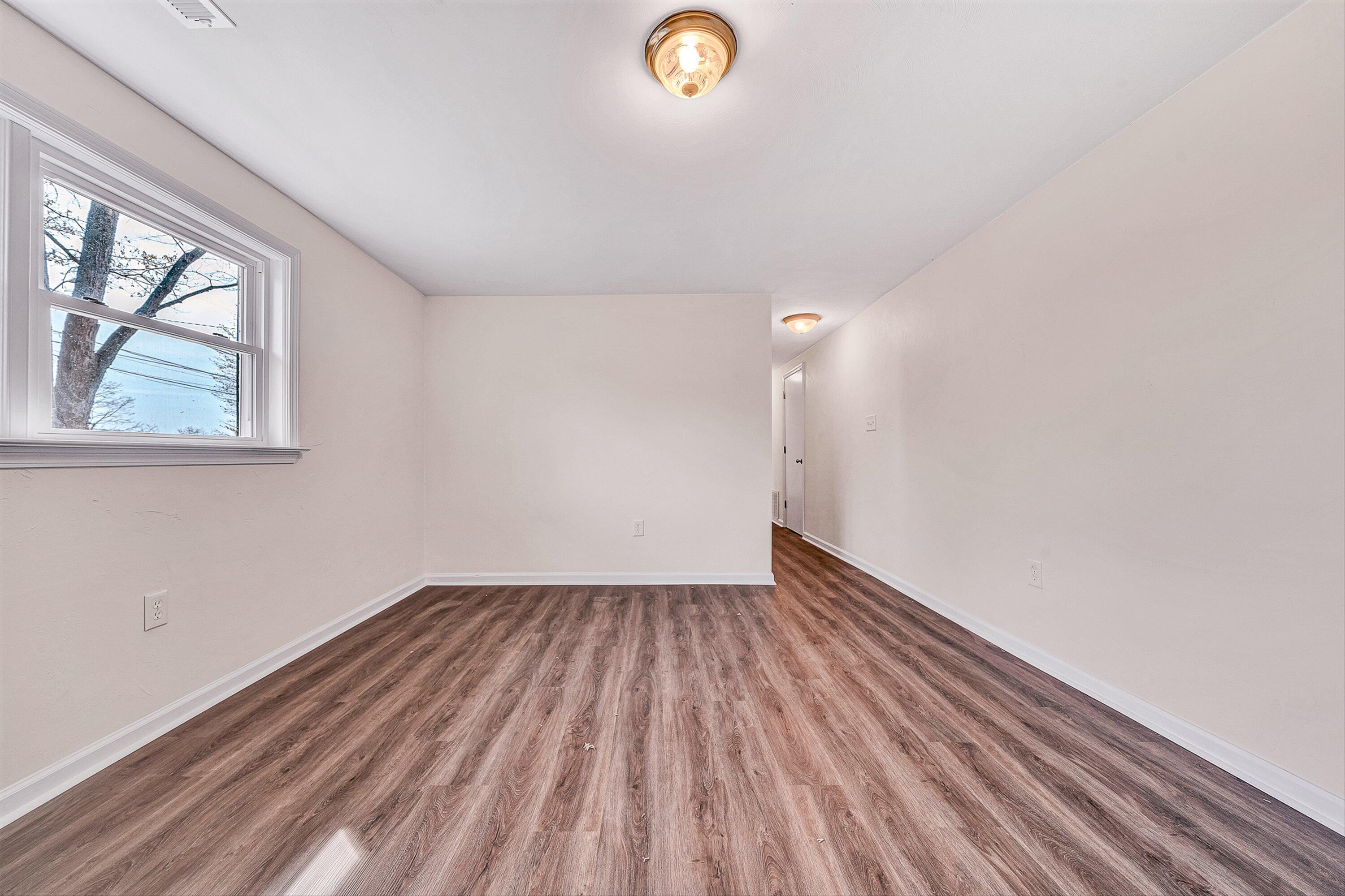 736 Ramada Road Vinton, VA 24179 - Photo 24 of 37 wooden floor in an empty room with a window