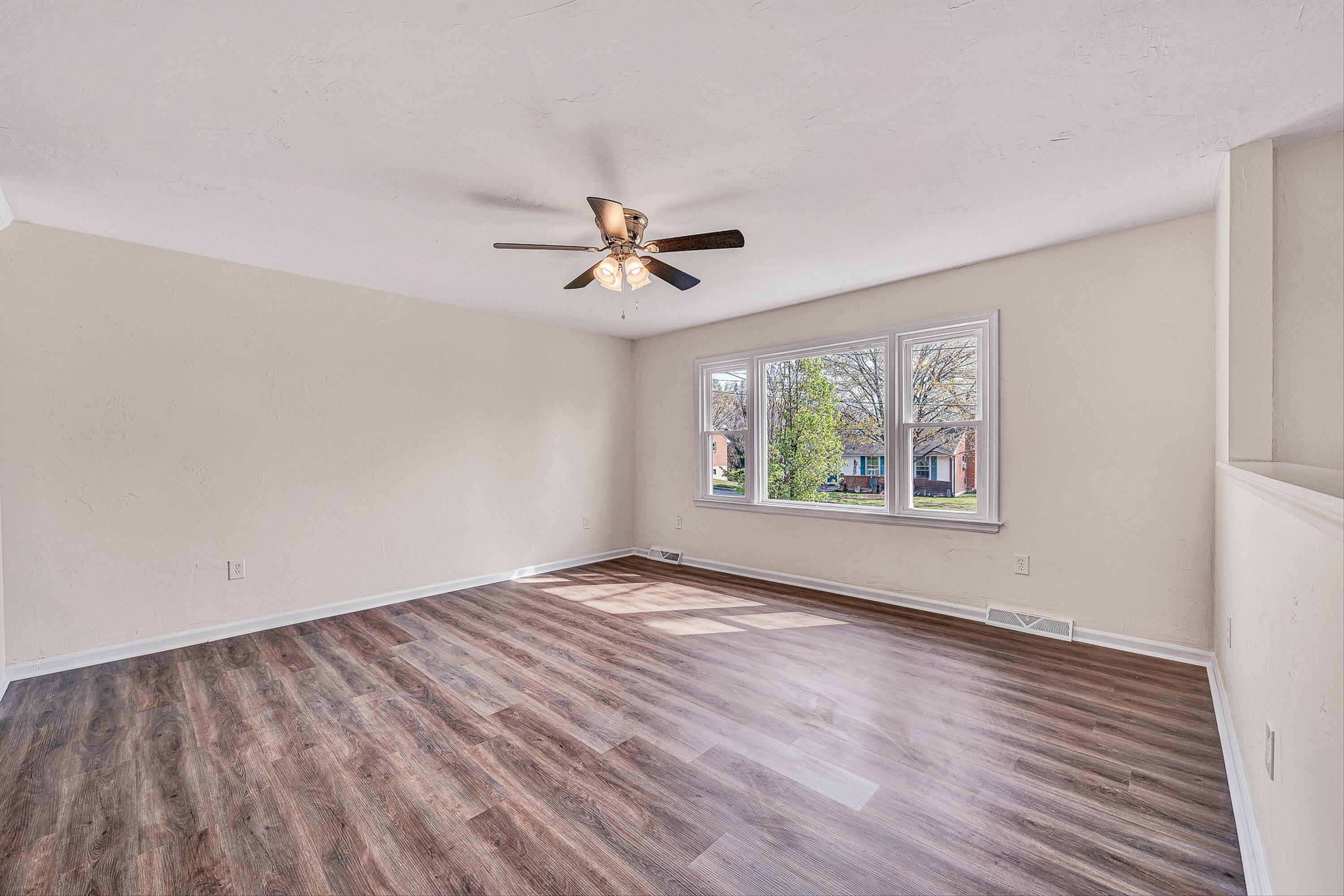 736 Ramada Road Vinton, VA 24179 - Photo 4 of 37 wooden floor in an empty room with a window