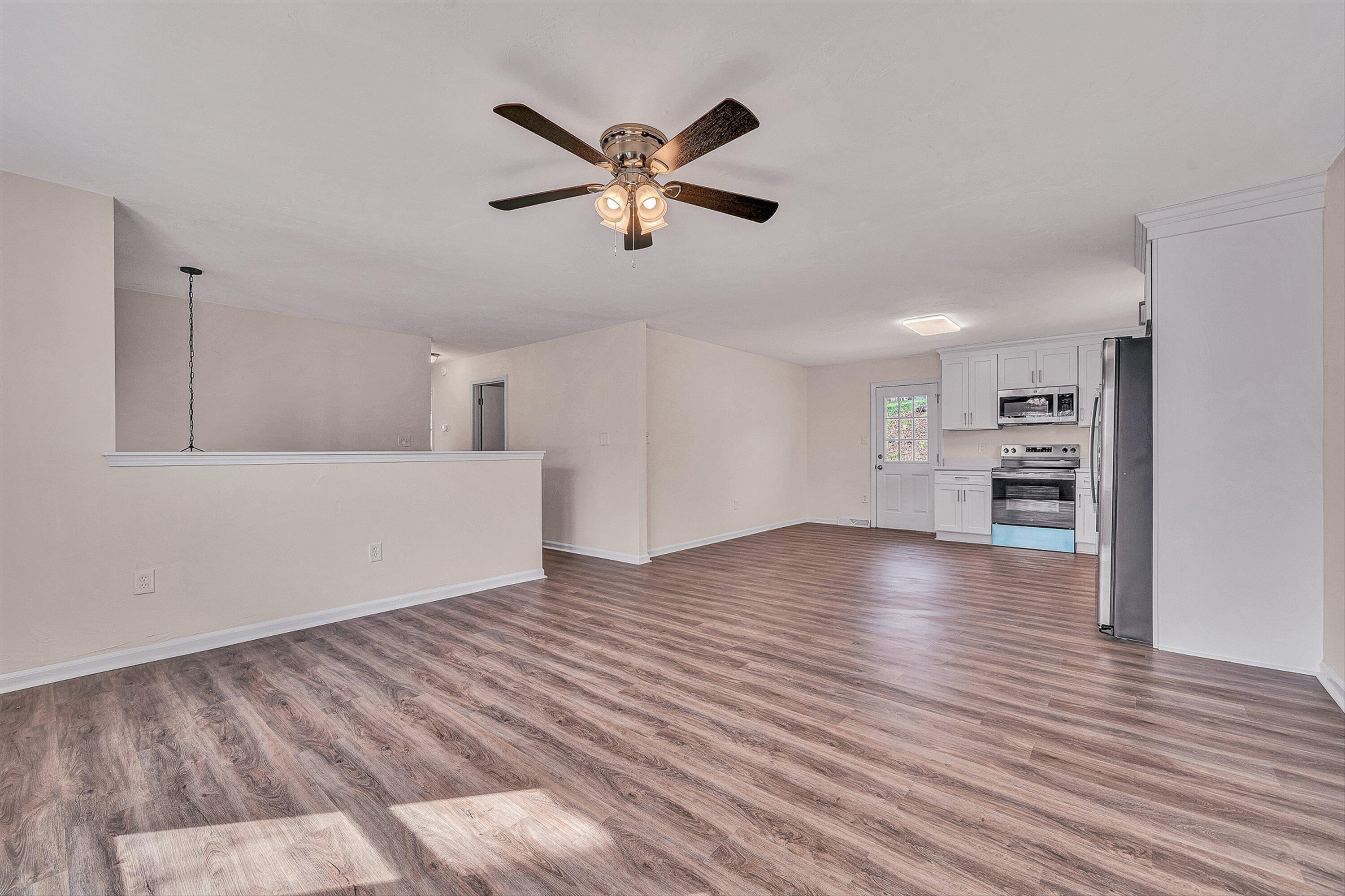736 Ramada Road Vinton, VA 24179 - Photo 6 of 37 a view of empty room with wooden floor and window