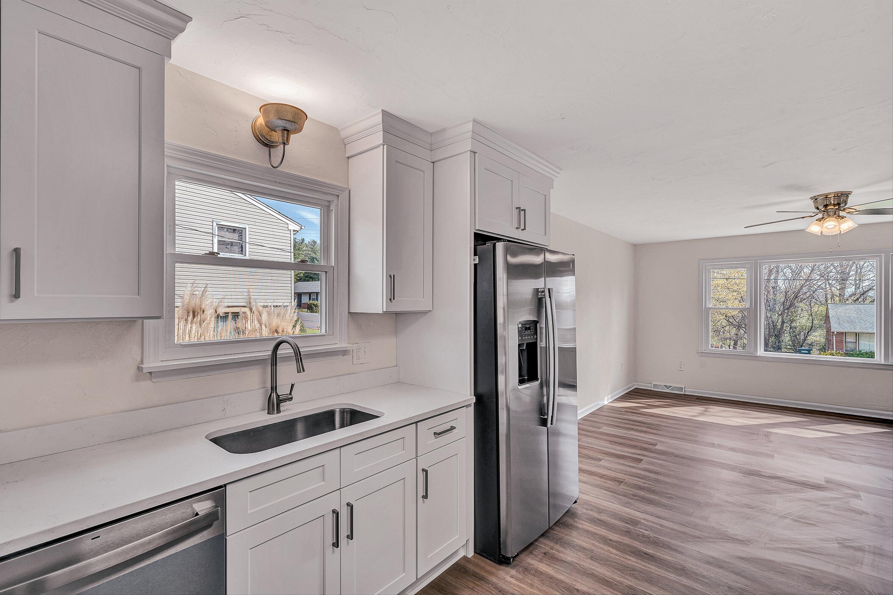 736 Ramada Road Vinton, VA 24179 - Photo 10 of 37 a kitchen with a sink and refrigerator