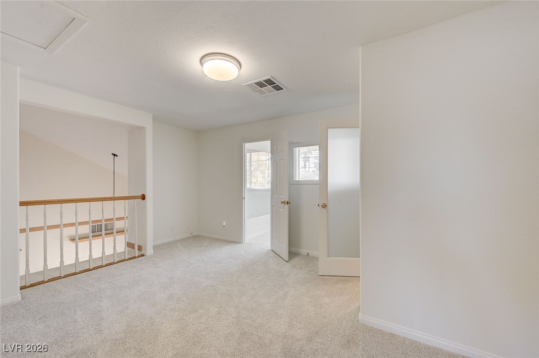 2955 El Camino Road Las Vegas, NV 89146 - Photo 62 of 99 Unfurnished room with light carpet and baseboards
