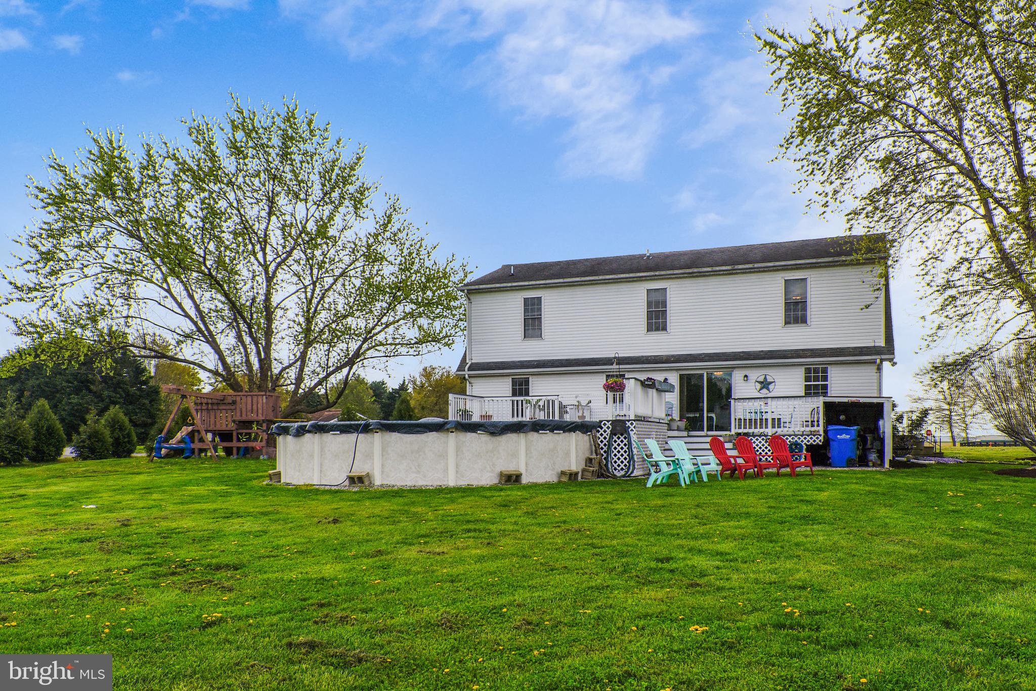 12845 Irelands Corner Road Galena, MD 21635 - Photo 5 of 54 Back exterior with large deck & pool.