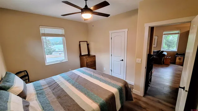 a bedroom with a large bed and a window